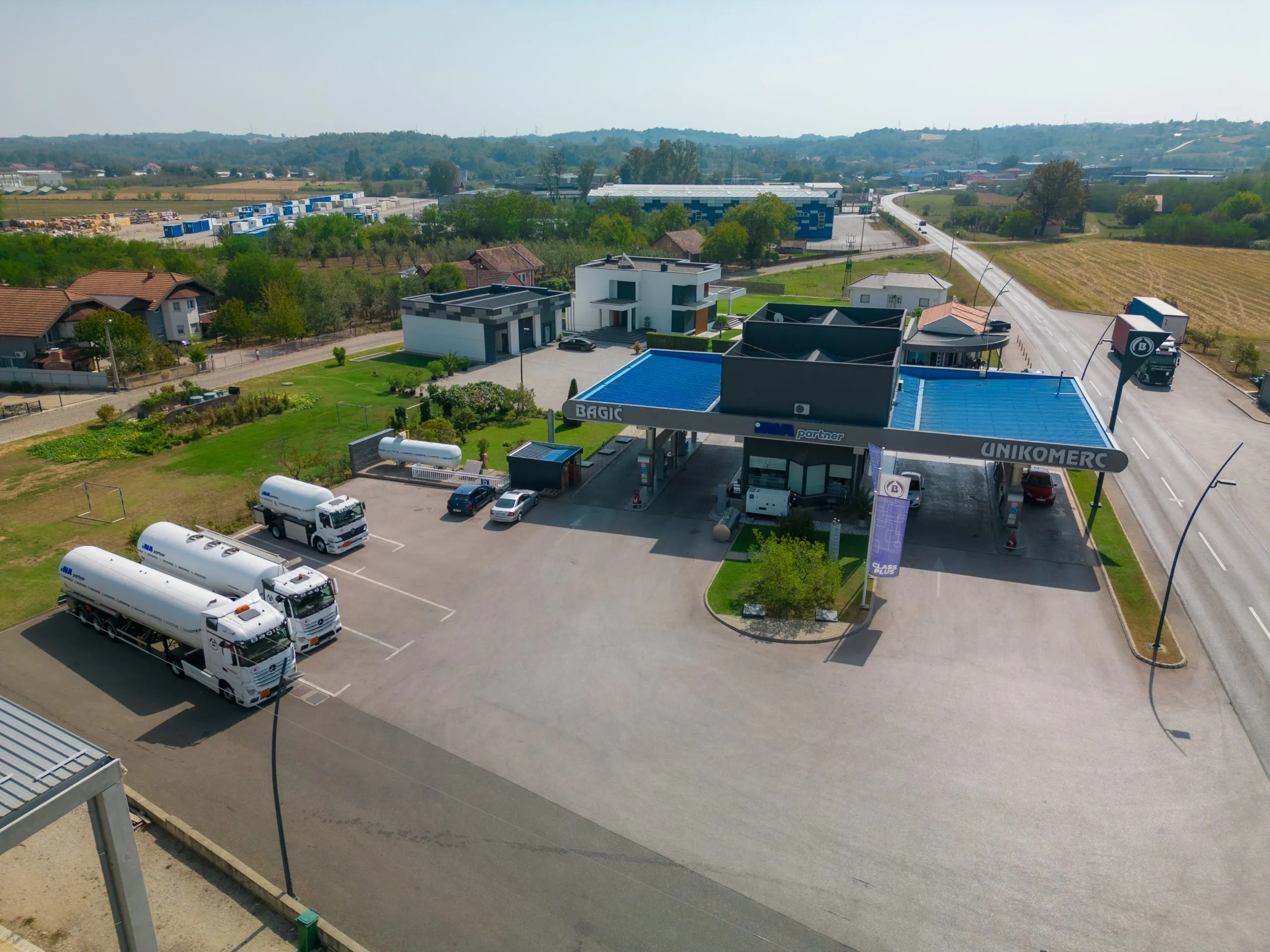 The Unikomerc complex from the air with tanker trucks